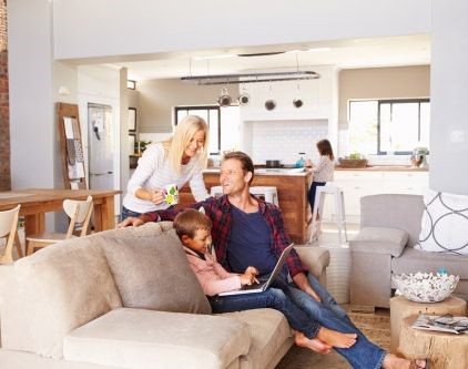 a picture of a family in a lounge room